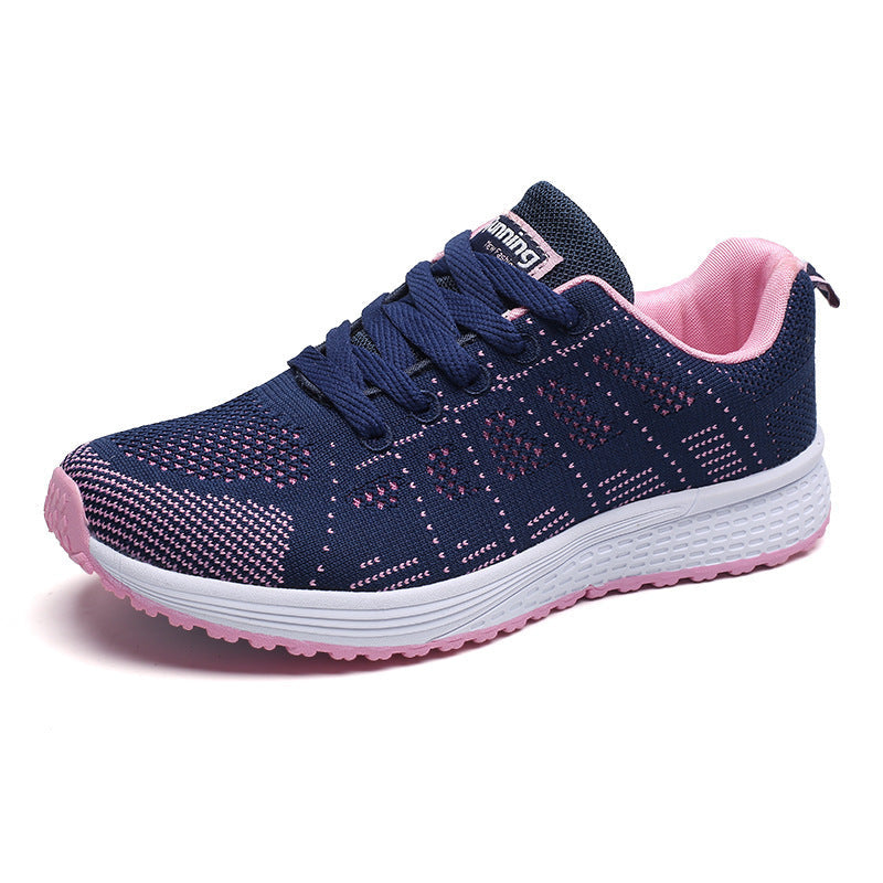 Amber ademende hardloopschoenen in donkerblauw met roze accenten, zijaanzicht
