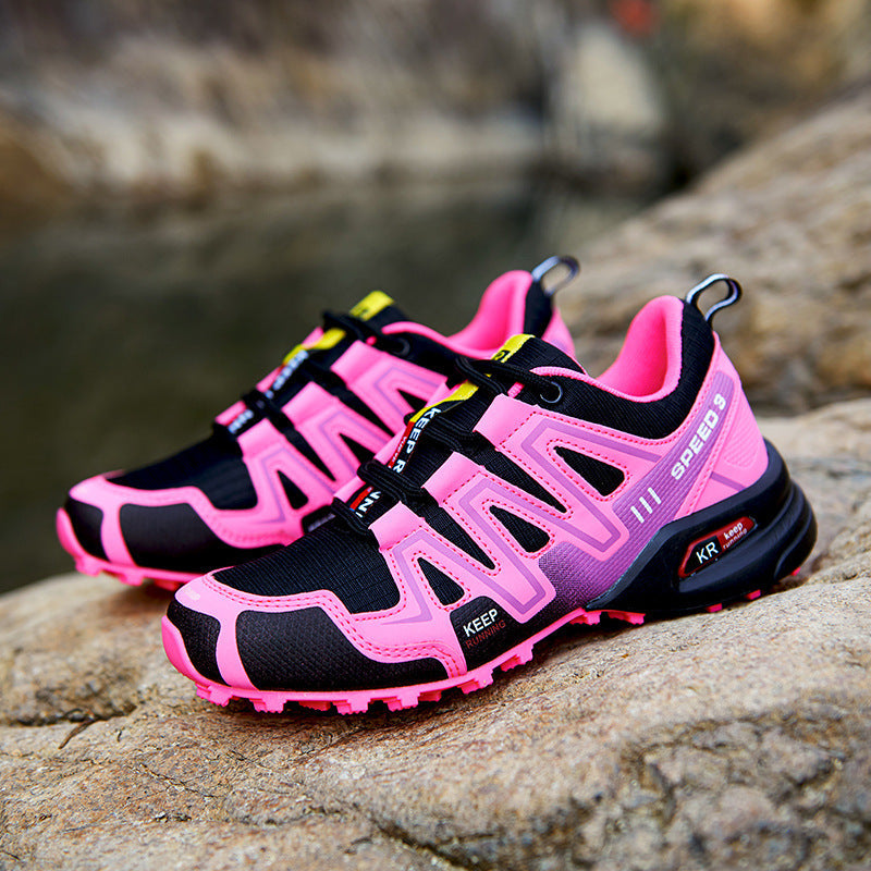 Anouk roze en zwarte trail hardloopschoenen, zijaanzicht op rots