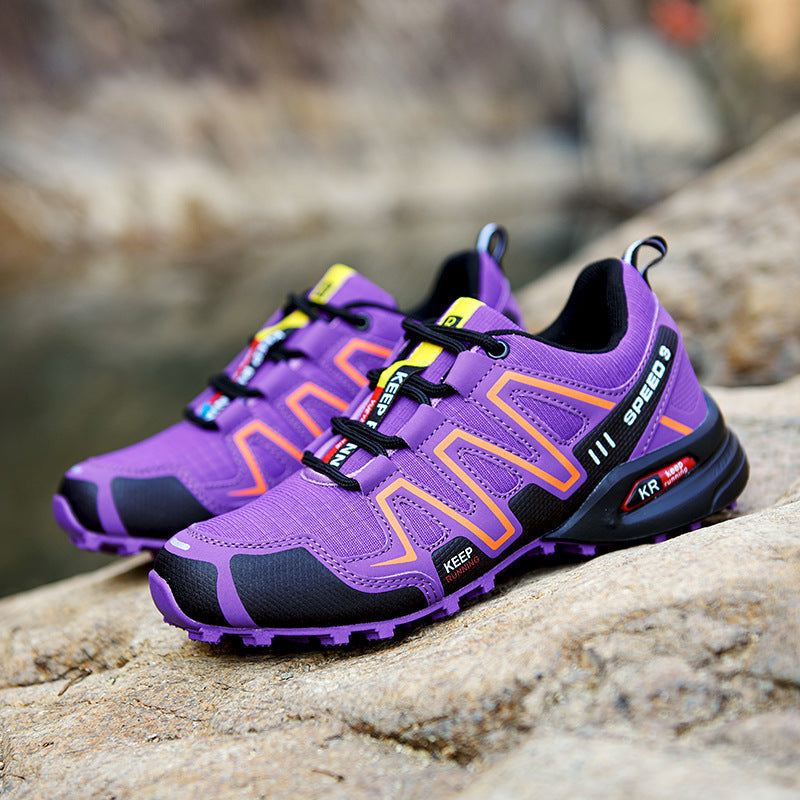 Anouk lila trail hardloopschoenen met oranje details, zijaanzicht