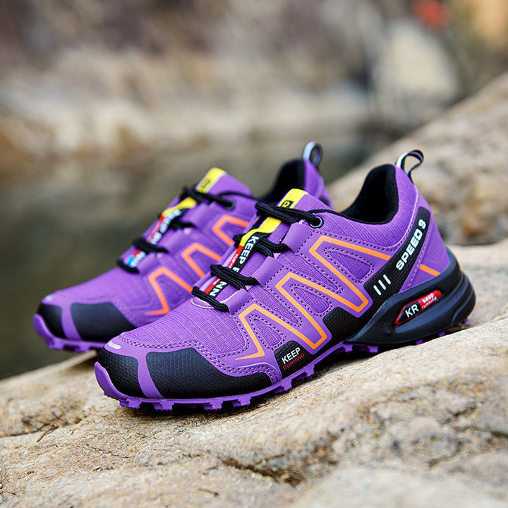 Anouk lila trail hardloopschoenen met oranje details, zijaanzicht