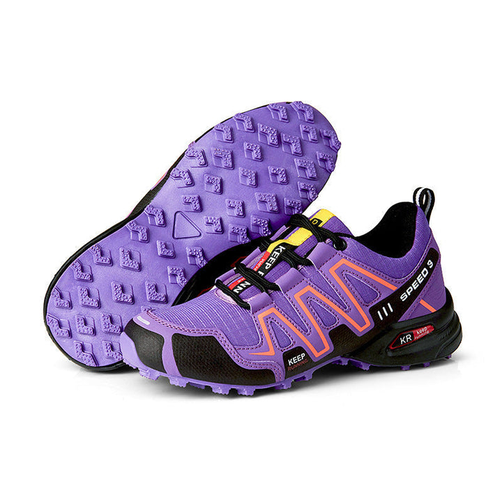 Anouk lila trail hardloopschoenen met oranje details en zool