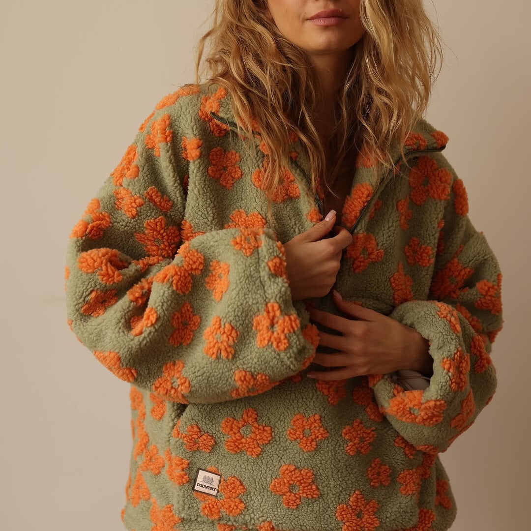 Bente bloemenprint fleece trui, close-up voorzak en rits