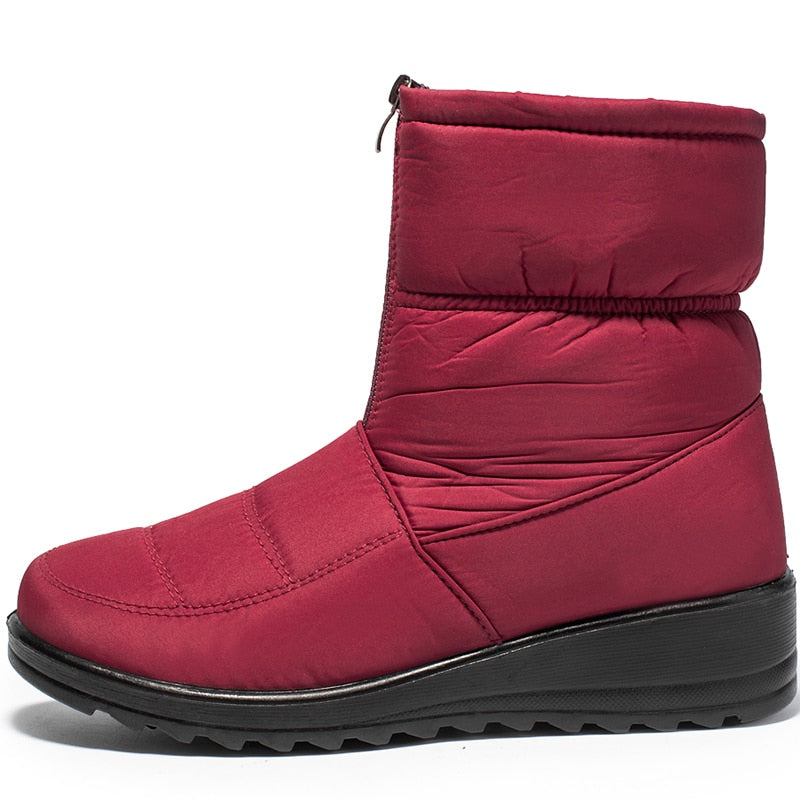Femke rode snowboot, zijaanzicht