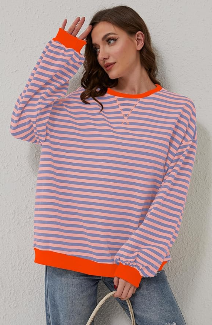 Iris gestreepte sweater close-up voorkant met oranje contrastboord