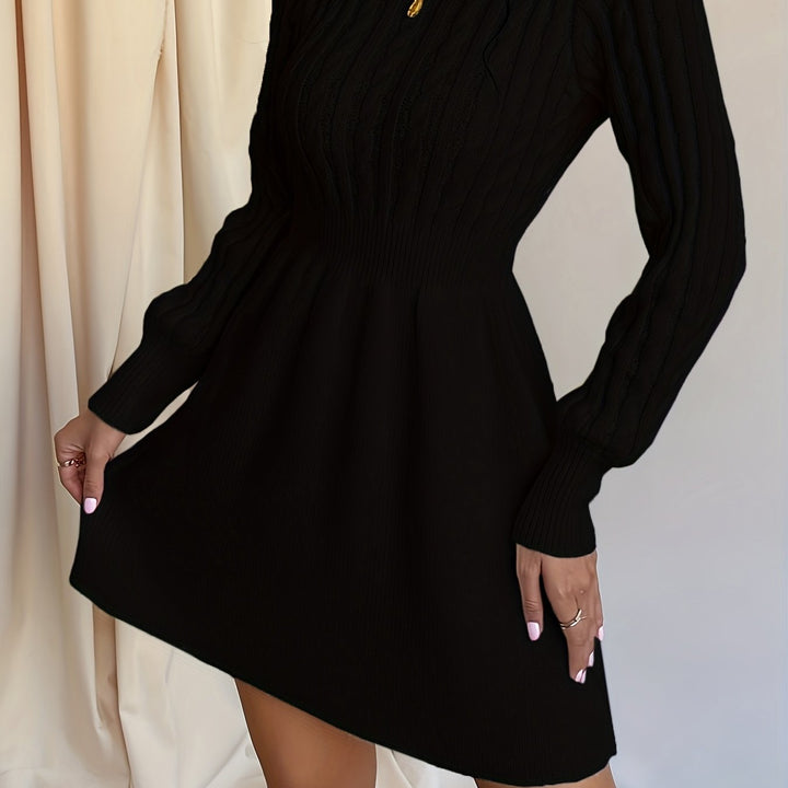 Marit kabelbrei winterjurk in zwart, close-up rok