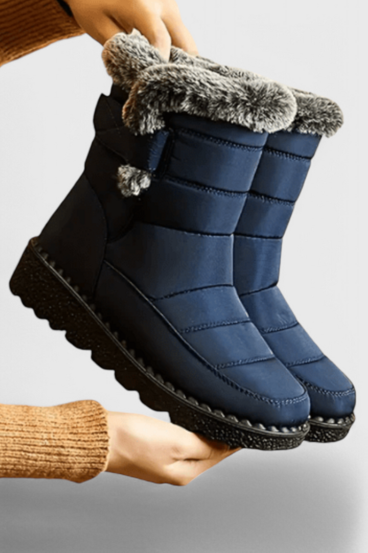 Roos waterdichte winterlaarzen in blauw met bontrand, zijaanzicht